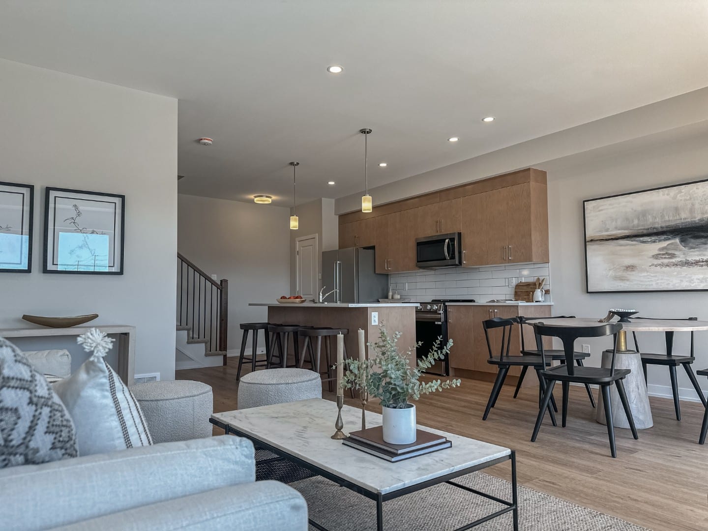 A contemporary condominium kitchen featuring custom cabinetry, stainless steel appliances, and a functional island design in Ottawa.