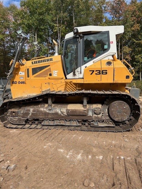 A high-performance Liebherr crawler dozer positioned for fine-grading work on a new development project in Ottawa.