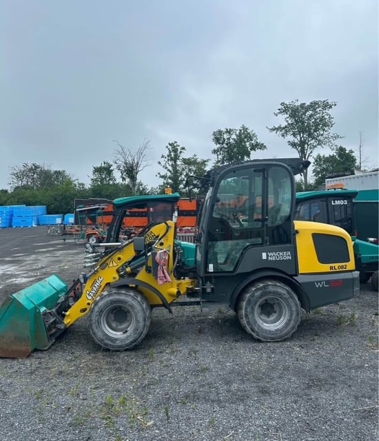 A clean, well-maintained compact loader parked in a staging area ready for municipal infrastructure work in Eastern Ontario.